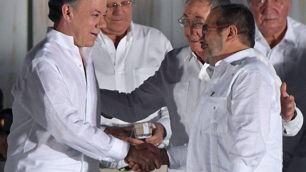 Colombian President Juan Manuel Santos and the Farc leader known as Timochenko shake hands in ceremony in Cartagena in September