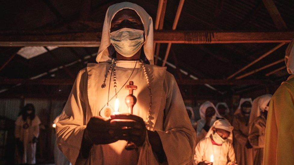 Worshippers of Legio Maria Church wearing face masks at their church in Kibera, Nairobi, Kenya - 25 December 2020