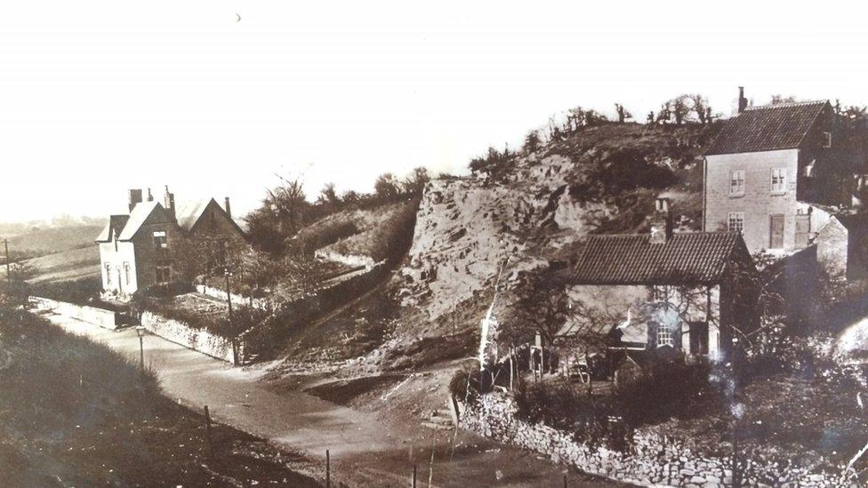 The postcard features a picture of Old School House and Rock Cottages, in Shirebrook,