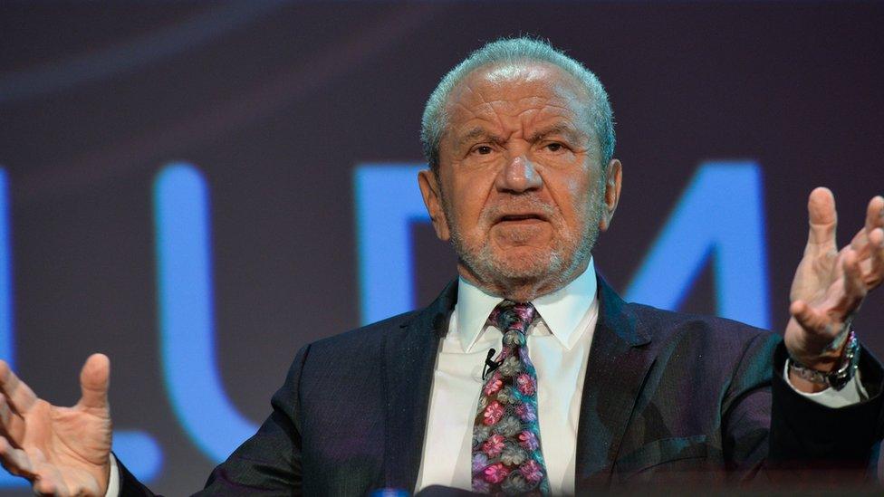 Lord Alan Sugar speaking at a summit