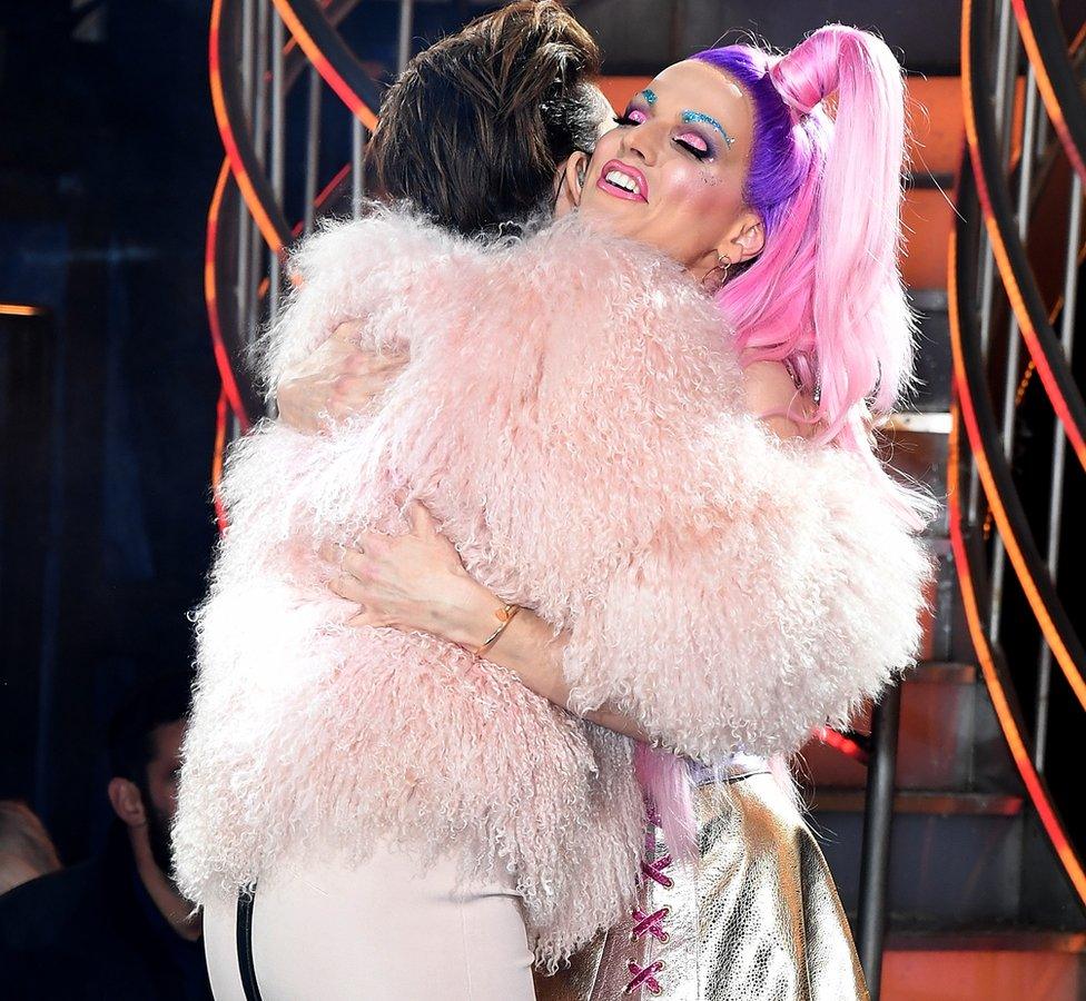 Courtney Act hugging Emma Willis