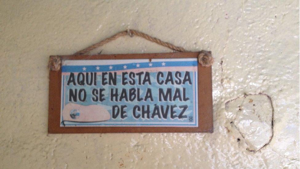 A sign on a house in Monte Carmelo reads "In this house no one talks badly about Chavez"