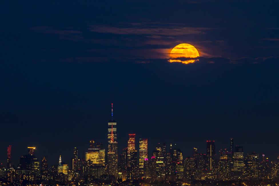 The supermoon rises over Lower Manhattan, New York City