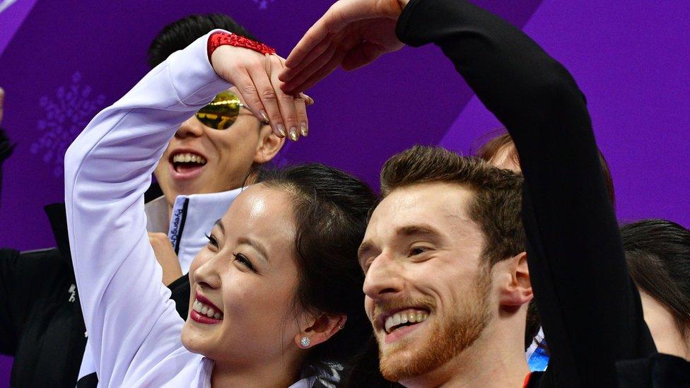 Yura Min and Alexander Gamelin react after finishing their dance