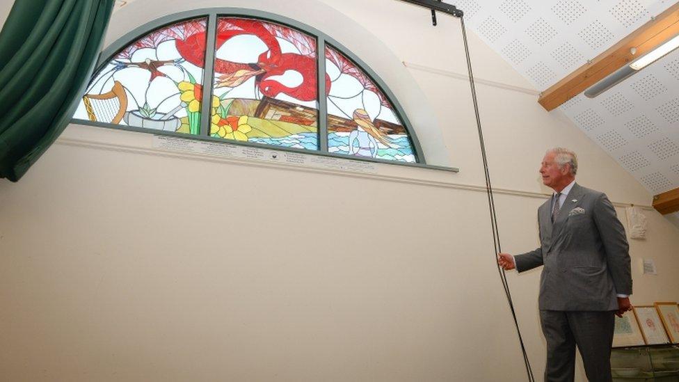 Prince Charles unveils a stained glass window at Myddfai Community Hall in Llandovery, Carmarthenshire