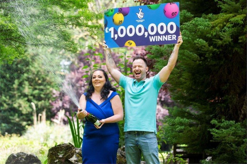 Sammantha Young and husband Paul with lottery cheque