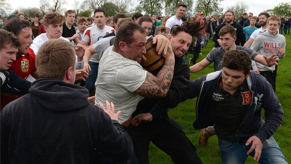 Thick of the action in the bottle kicking match