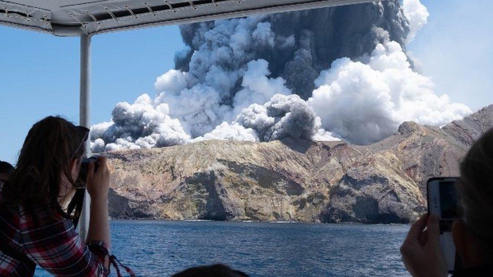 Tourist take pictures of the White Island eruption