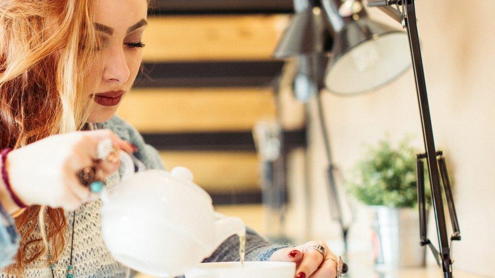 Woman pouring tea