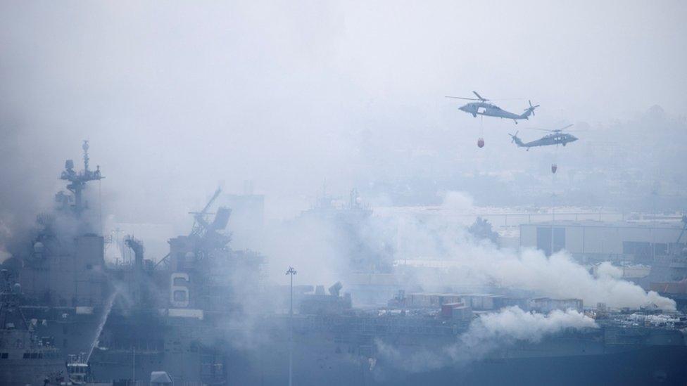 US Navy helicopters try to contain fire on USS Bonhomme Richard. Photo: July 2020