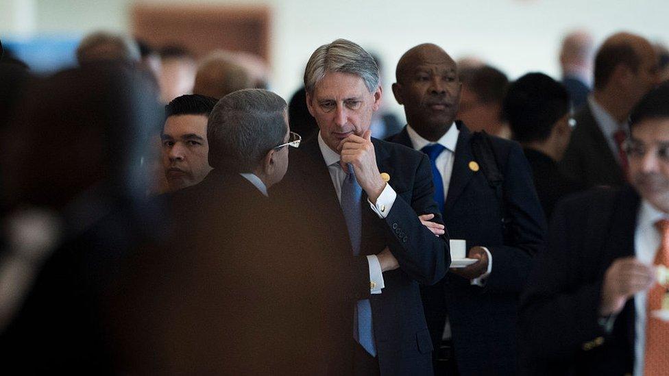 Chancellor Philip Hammond speaks with delegates