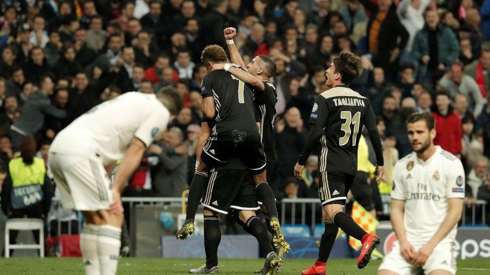 Ajax team celebrates after scoring a goal during UEFA Champions League