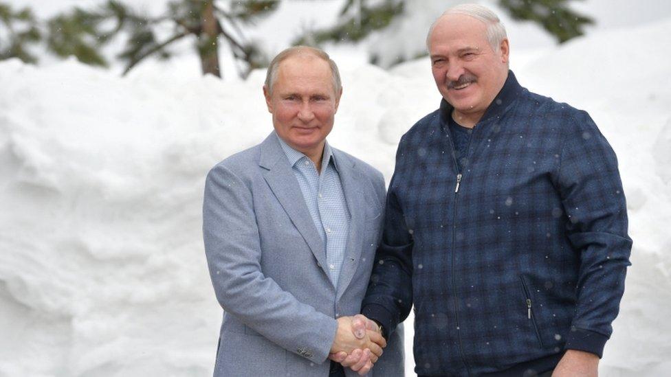 Russian President Vladimir Putin shakes hands with his Belarusian counterpart Alexander Lukashenko during a meeting in Sochi, Russia February 22, 2021