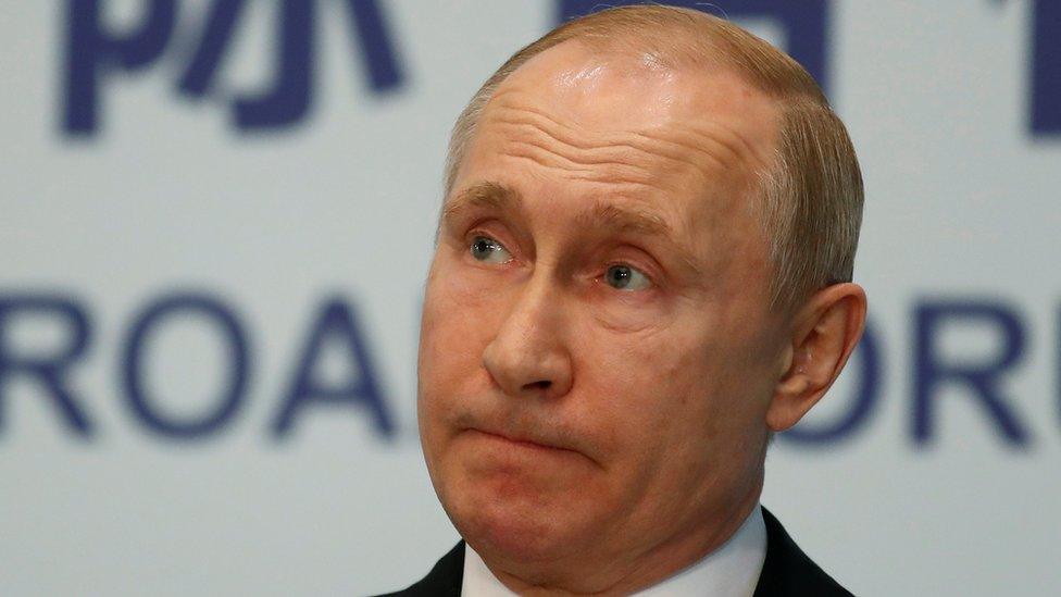 Russian President Vladimir Putin is seen at a news conference in Beijing