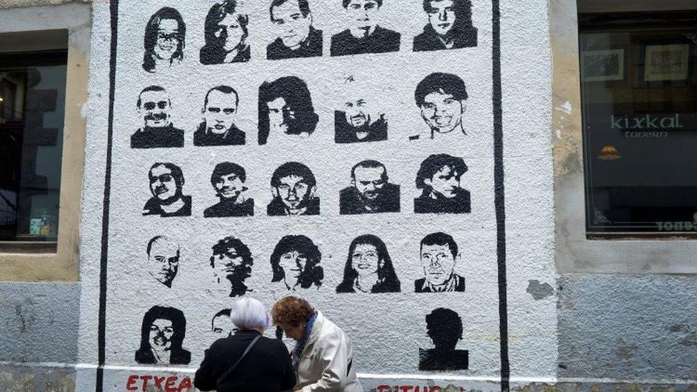 A mural depicting imprisoned armed Basque group Eta members, under which reads "We Want Them Home", in the Basque town of Hernani (31 March 2017)