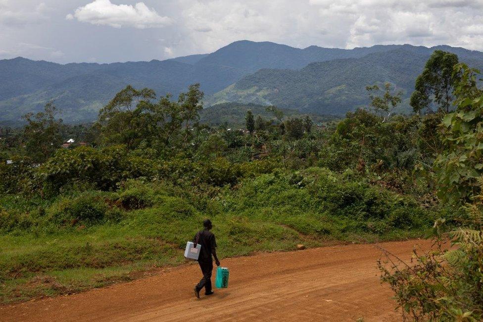 Mulalu Lwesso walks down a country road