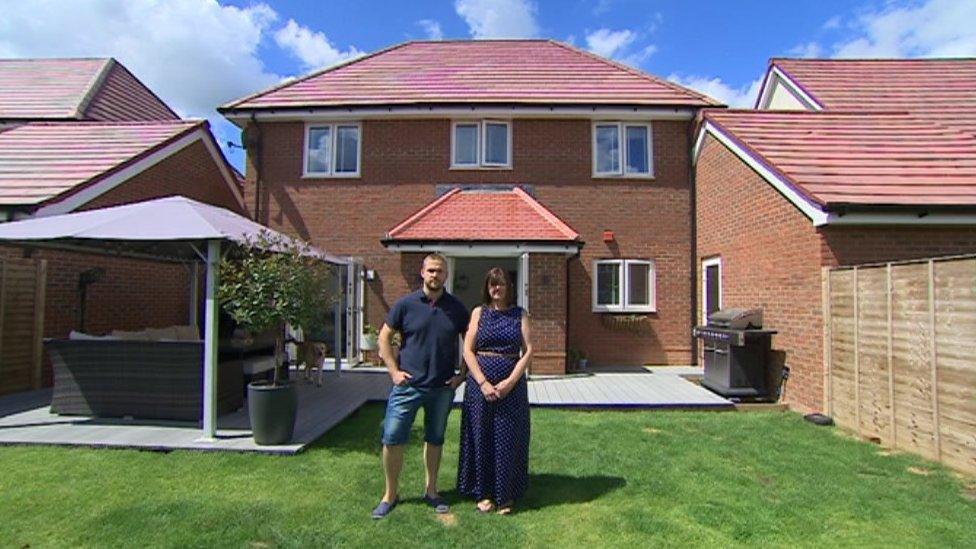 Joe and Claire Tompkinson stood outside their house