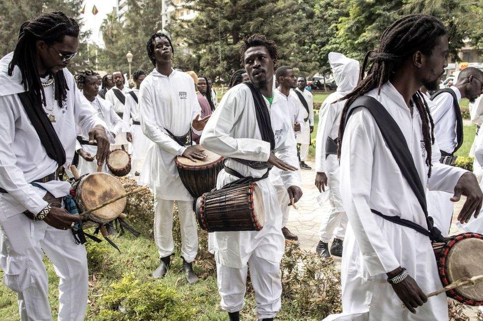 Followers of Amadou Bamba play drums during celebrations for the anniversary of his return from exile in Dakar. Amadou Bamba is the founder of the Senegalese Islamic Mouride Brotherhood and culturally fought, with no violence, against colonial rule. He was exiled to Gabon for seven years for his opposition to the colonisation.