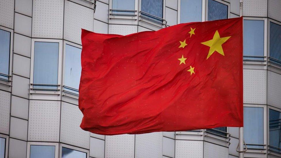 he Chinese national flag waves in front of the Chinese embassy in Berlin, Germany, 22 April