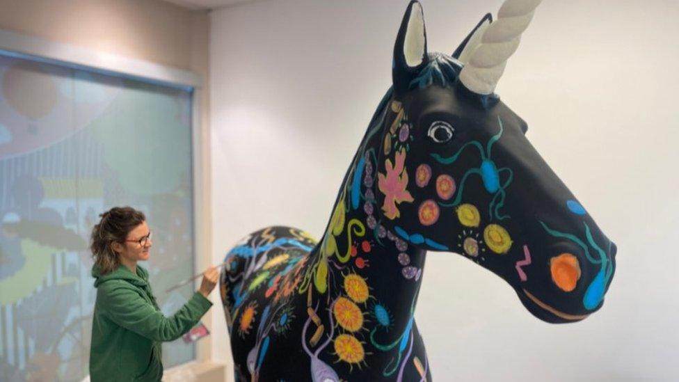 A unicorn being painted in Bristol's Broadmead shopping centre