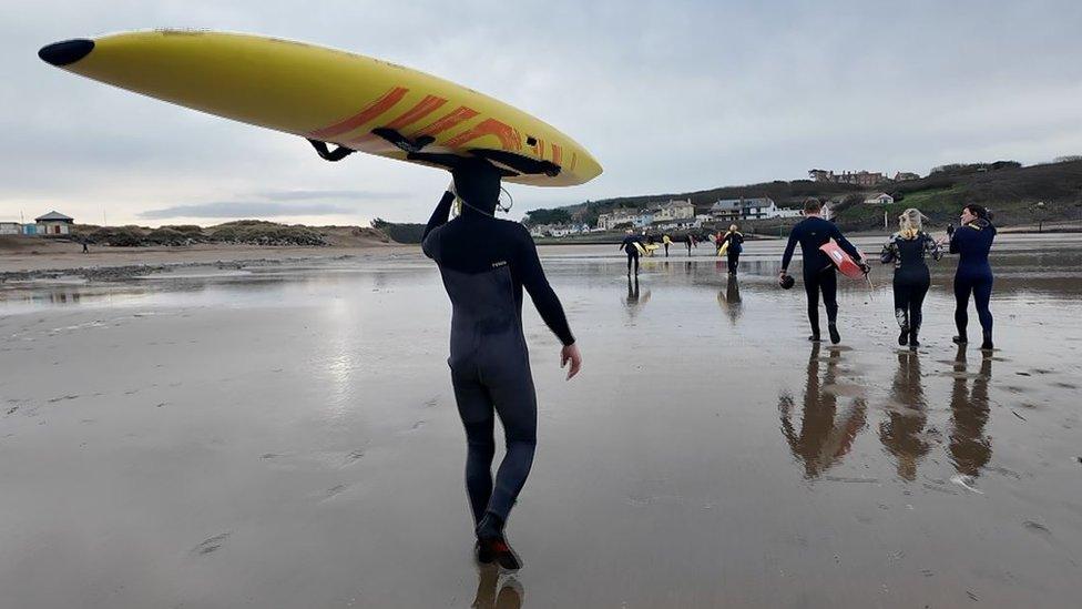 Surfers on Crooklets Beach