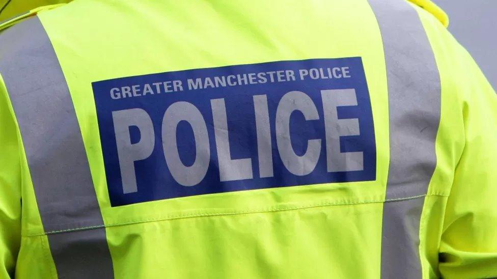 Stock shot of the back of a Greater Manchester Police officer