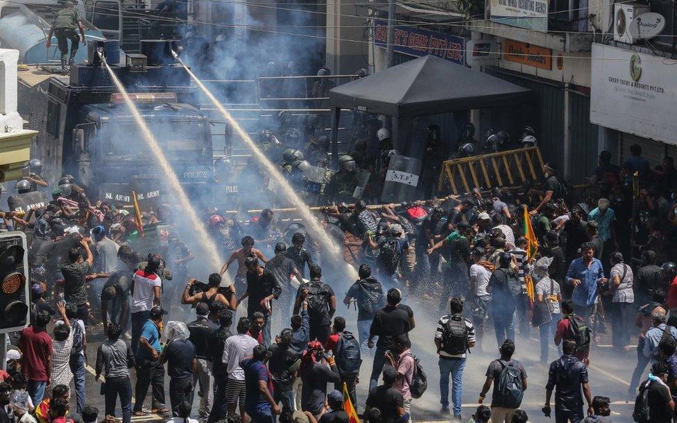 Security forces' water cannon hitting demonstrators in Colombo, 9 Jul 22