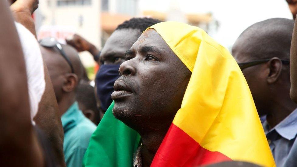 A man looks on during a protest to support the Malian army in Bamako, Mali, on August 21, 2020