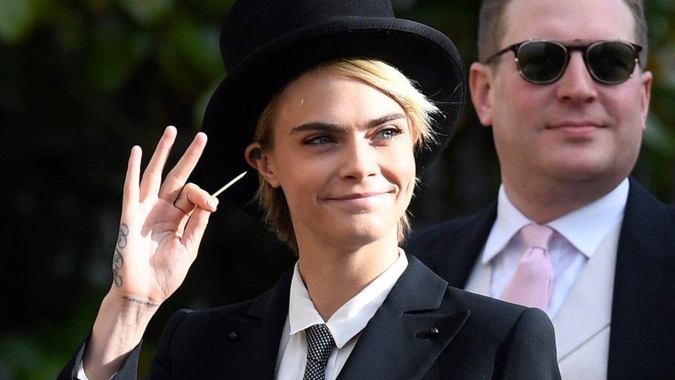 British model and actress Cara Delevingne arrives for the royal wedding ceremony