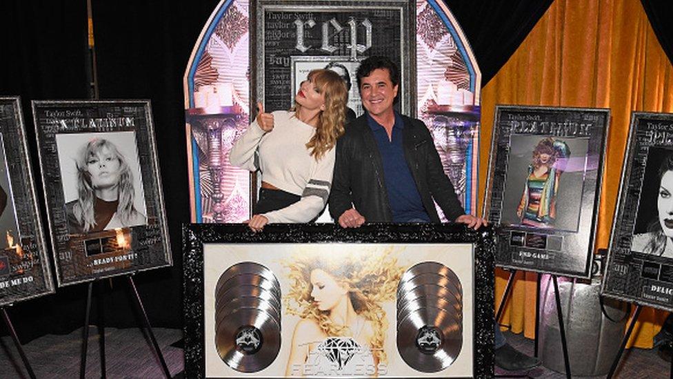 taylor and scott posing in front of eps