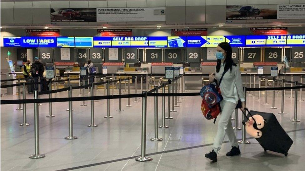 Passenger in mask at Manchester Aiport