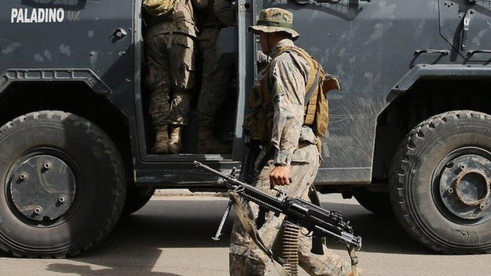 soldiers getting in to a truck