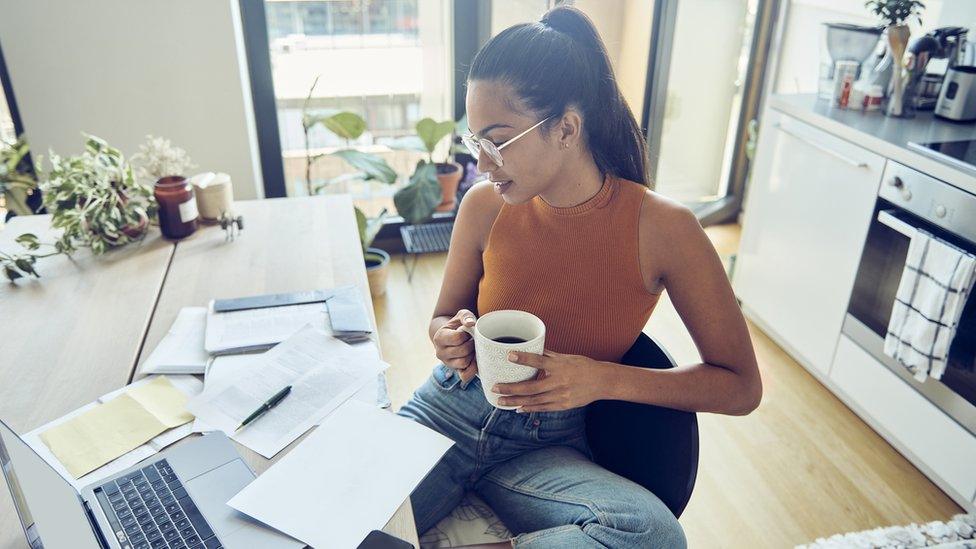 Woman looking at household bills