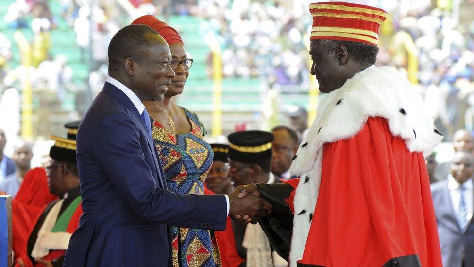 Benin's President Patrice Talon with his wife Claudine Gbenagnon and a judge at his swearing-in ceremony in Cotonou, Benin - Wednesday 6 April 2016