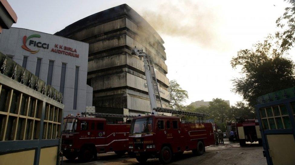 Firefighters try to extinguish a fire that broke out in the National Museum of Natural History in the Federation of Indian Chambers of Commerce and Industry (FICCI) complex in New Delhi, India, 26 April 2016.