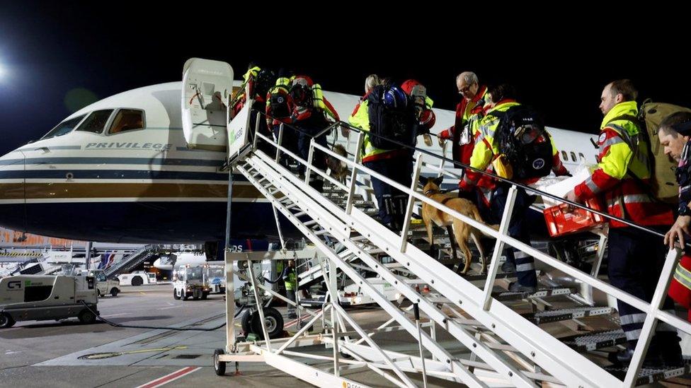 Rescuers of International Search and Rescue (ISAR) Germany board plane to help Turkey