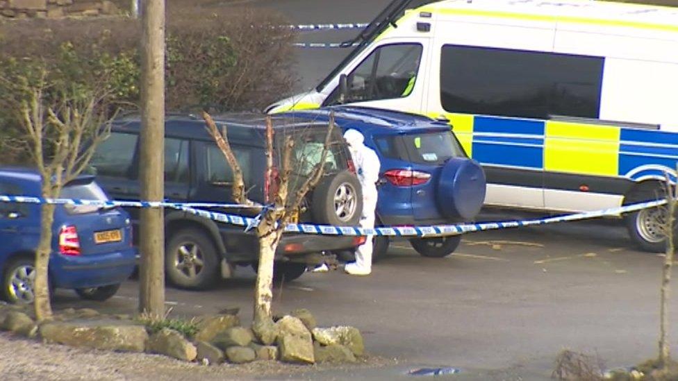 Forensic teams in car park