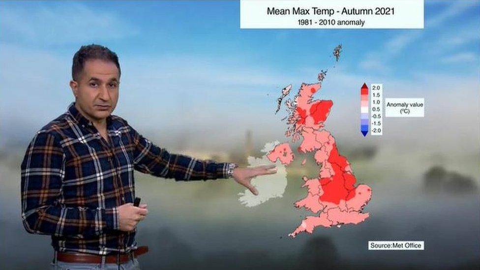 Stav Danaos in front of an anomaly map of the UK