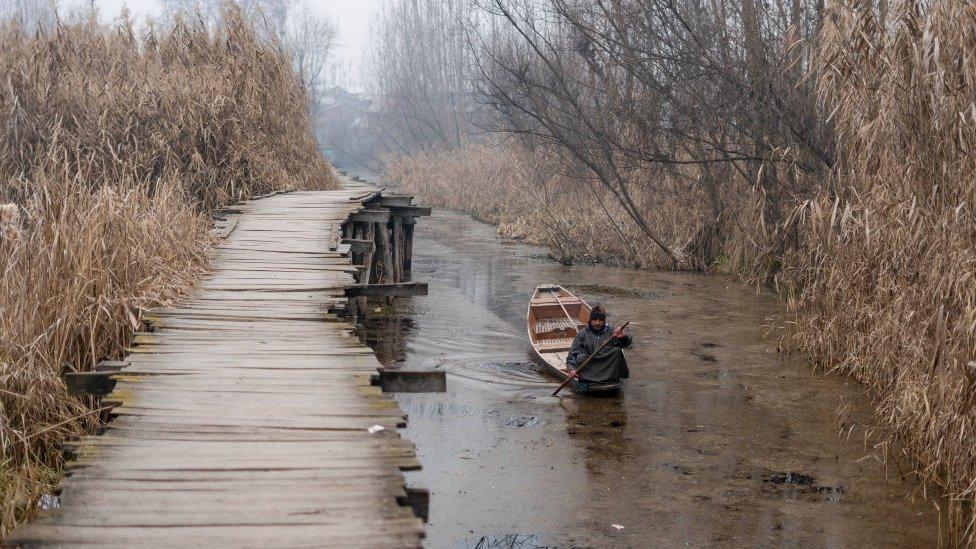 A Boatman rows his boat on Dal Lake during a cold morning. A 40-day long period of harsh winter cold known locally as the 'Chillai Kalan' started on December 21 and should end on January 30. (Photo by Idrees Abbas/SOPA Images/LightRocket via Getty Images)