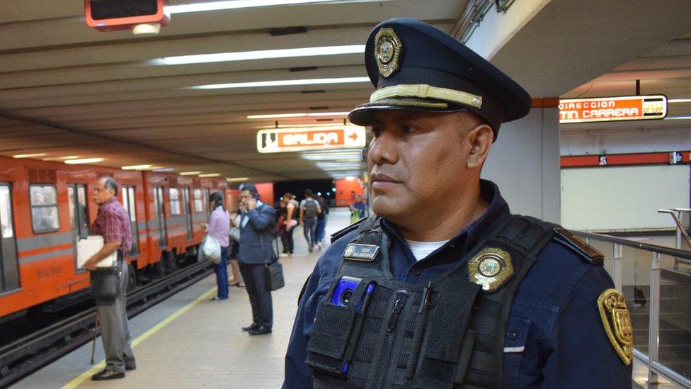 Ismael Ramos poses for a photo in the metro in Mexico City