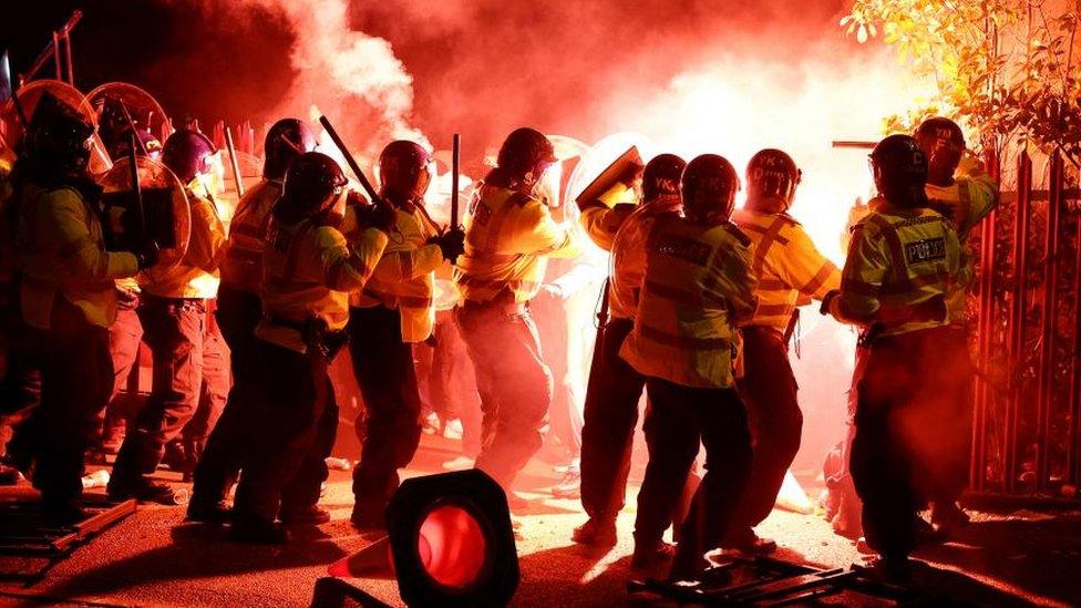 Police officers in disorder outside a football stadium