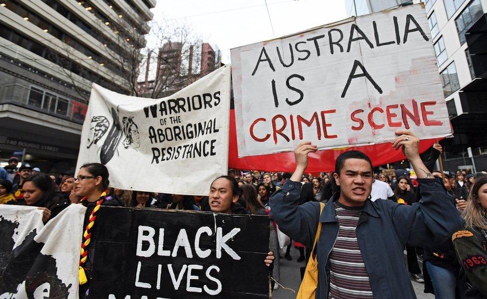 Protesters march down Bourke street in Melbourne, Australia, 28 July 2017.