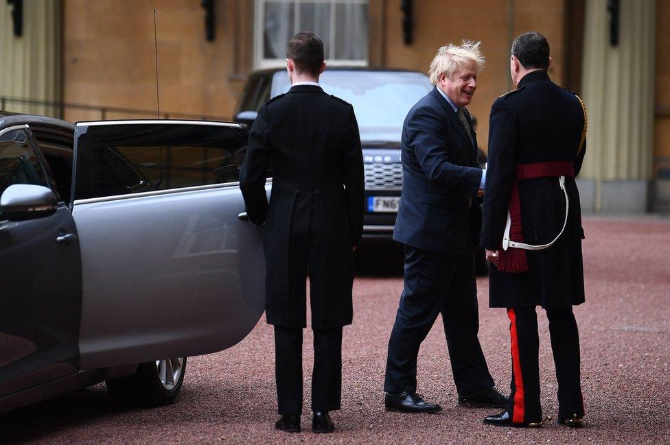 Prime Minister Boris Johnson arrives at London's Buckingham Palace for an audience with Queen Elizabeth II