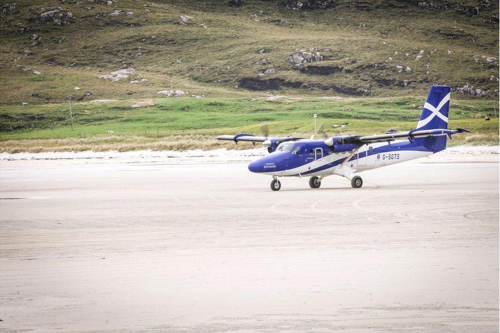 Barra plane landing on the beach