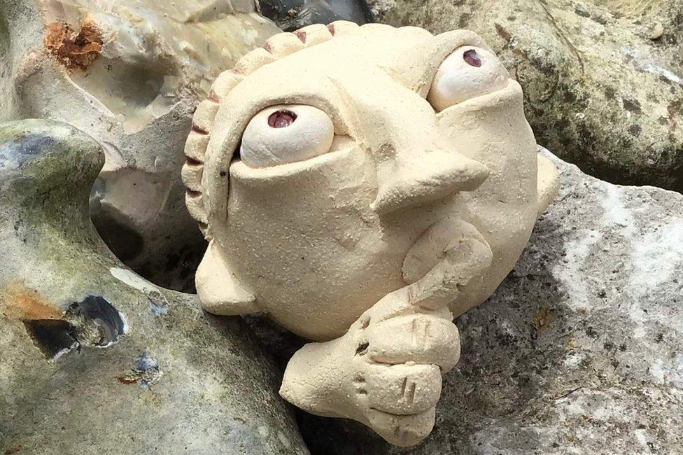 One of the ceramic figures of a Benedictine monk within the walls of the Abbey of St Edmund