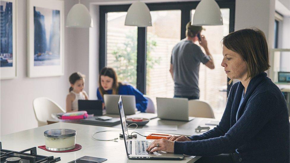 Stock image of people working from hom