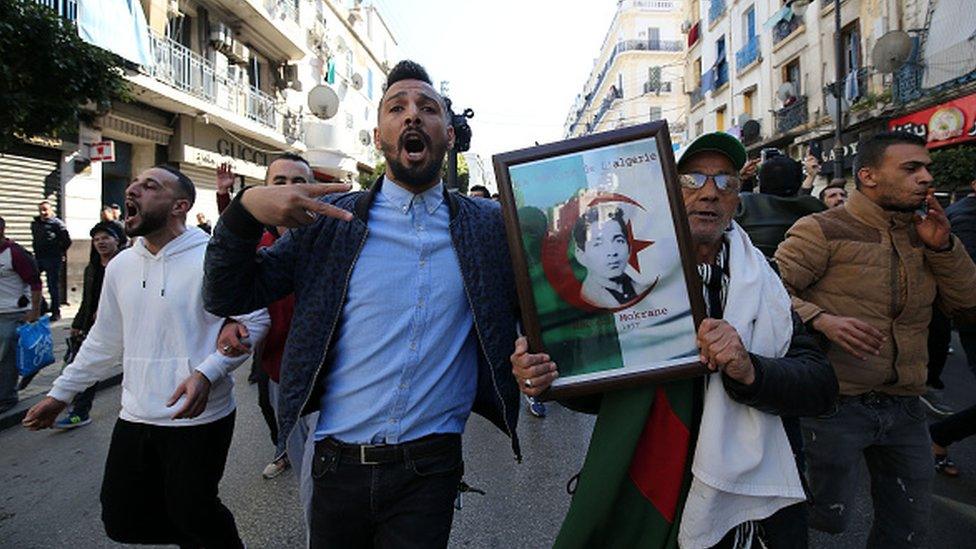 Algerian protesters chant slogans during a demonstration protest against the fifth term of Abdelaziz Bouteflika