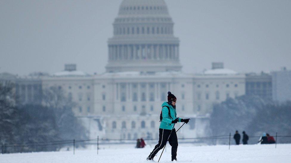 A cross country skier passes the US Capitol during a winter storm January 13, 2019 in Washington