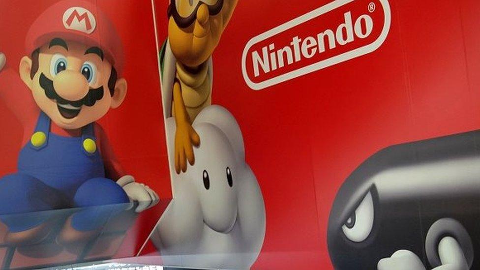 A Nintendo logo and its game characters are displayed at an electronics retail shop in Tokyo