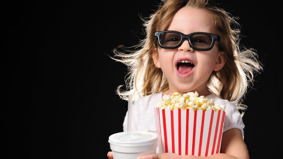 excited-girl-popcorn-glasses.